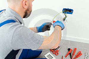 Professional electrician working on the electrical system