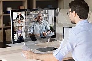 Professional employee man talking to diverse business group