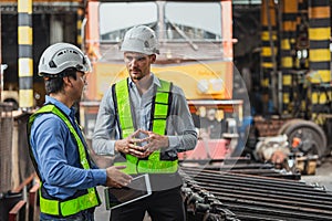 Professional engineer mechanic team working together in locomotive train deport work checking train spare parts in the locomotive