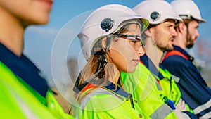 Professional engineer technician working outdoor at wind turbine field