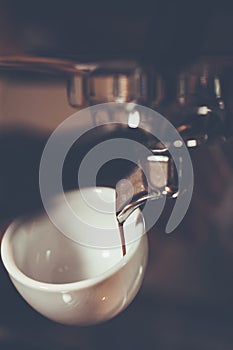 Professional espresso machine brewing a coffee. Coffee pouring i