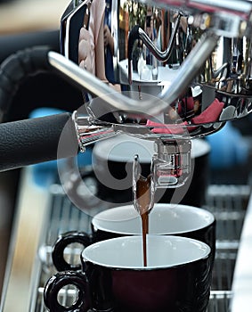 Professional espresso machine while preparing two espressos. Coffee machine.