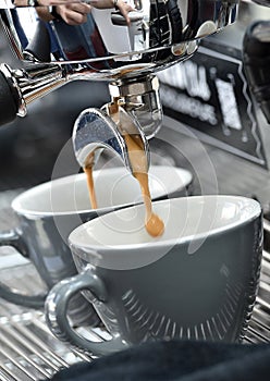 Professional espresso machine while preparing two espressos. Coffee machine.