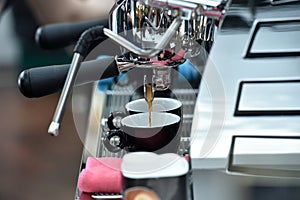 Professional espresso machine while preparing two espressos. Coffee machine.