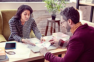 Professional female astrologist talking to her client