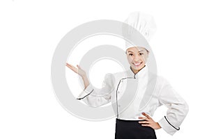 Professional female cook raise hands to show something