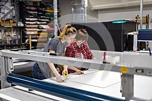 Professional female employees working in a printing house