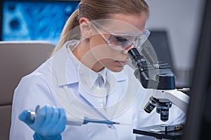 Professional female scientist is working on a vaccine in a scientific research laboratory. Genetic engineer workplace