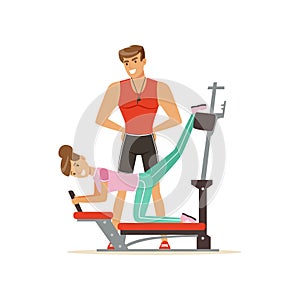 Professional fitness coach and woman exercising on trainer gym machine, people exercising under control of personal