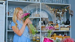 Professional florist preparing pink turkish carnation for bouque