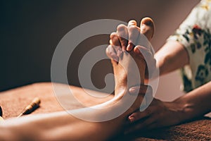 Professional foot massage close up.