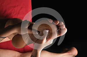 Professional foot massage close up. Reflexology foot massage.