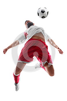 Professional football player in action. Footballer is dribbling with the ball. Isolated on white background photo