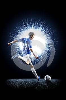 Professional football soccer player in action on black