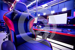 Professional gamers cafe room with powerful personal computer game chair blue color. Concept cyber sport arena