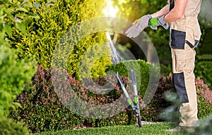 Professional Gardener Preparing Himself For Garden Job