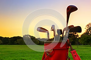 Professional golf clubs at sunset