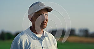Professional golf player enjoy course country club. Golfing coach looking away.