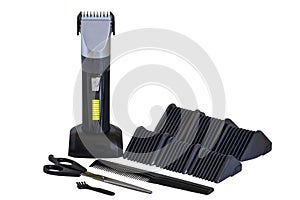 Professional hair clipper set. Rechargeable electric beard and hair clipper with comb, scissors, brush with different attachments