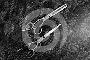 Professional hair cutting scissors on the board in a hairdressing salon