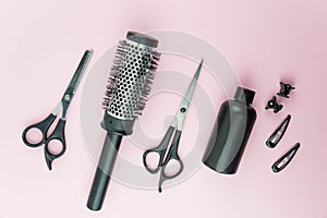 Professional hair dresser tools with copy space on trendy pink background. Hair stylist equipment set.