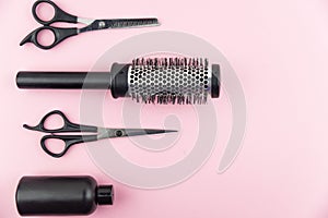 Professional hair dresser tools with copy space on trendy pink background. Hair stylist equipment set.