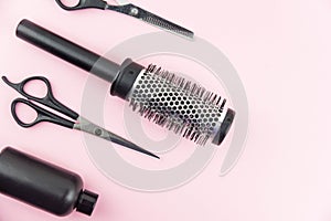 Professional hair dresser tools with copy space on trendy pink background. Hair stylist equipment set.