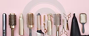 Professional hair dresser tools on pink background with copy space photo