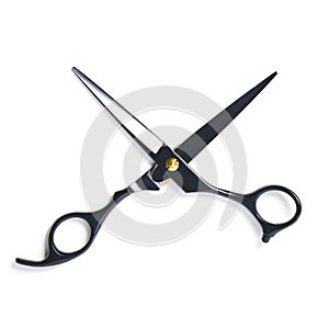 professional hairdresser black scissors isolated on white. Black barber scissors, close up.