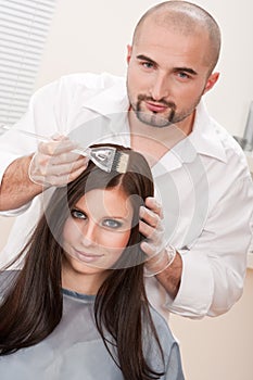 Professional hairdresser color customer at salon