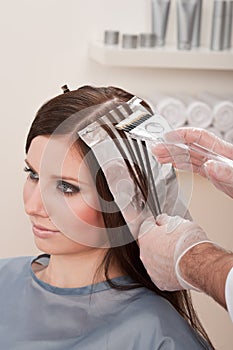 Professional hairdresser color customer at salon