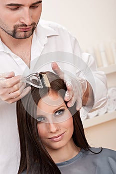 Professional hairdresser color customer at salon