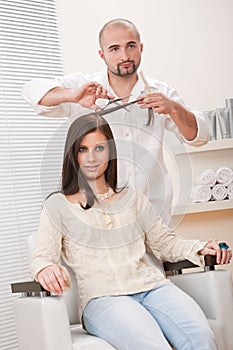 Professional hairdresser cut with scissors