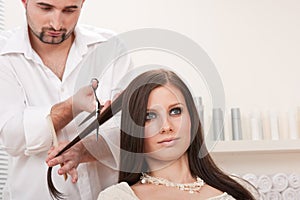 Professional hairdresser cut with scissors