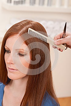 Professional hairdresser cut with scissors