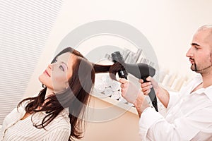 Professional hairdresser with hair dryer