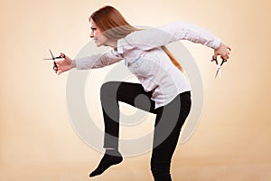 Professional hairdresser with scissors ready to cut.