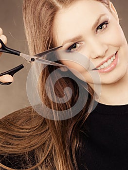 Professional hairdresser with scissors ready to cut