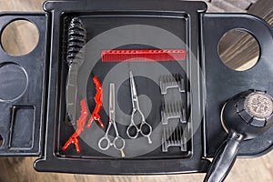 Professional hairdresser tools and hairdryer on a special stand