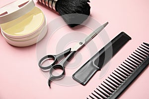 Professional hairstyling tools on pink background