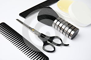 Professional hairstyling tools on background, closeup