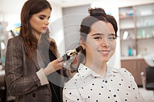 Professional hairstylist working at hair salon