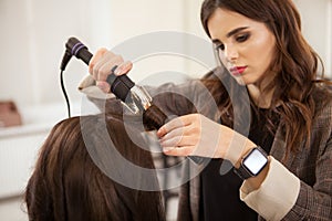 Professional hairstylist working at hair salon