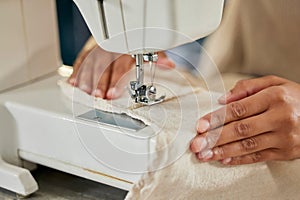 Professional, hands and machine for sewing fabric for stitching, fixing tear and creativity by zoom. Workshop