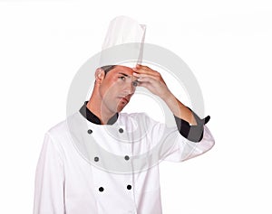 Professional handsome adult chef with headache