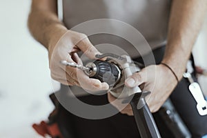 Professional handyman changing a drill bit