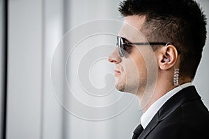 professional headshots, bodyguard work, side view