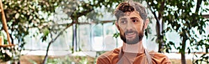 professional headshots, cheerful bearded gardener in