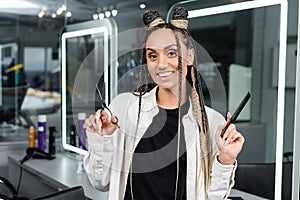 professional headshots, hairstylist with braids holding