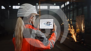 Professional Heavy Industry Engineer Uses Tablet Computer for Augmented Reality Render with Intera photo